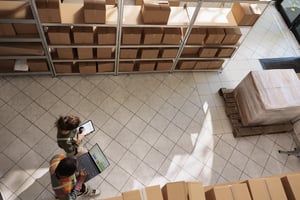diverse-storage-room-workers-tracking-customers-orders